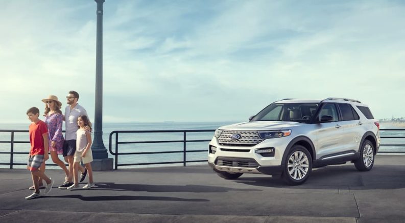 A family walks away from their parked 2023 Ford Explorer.