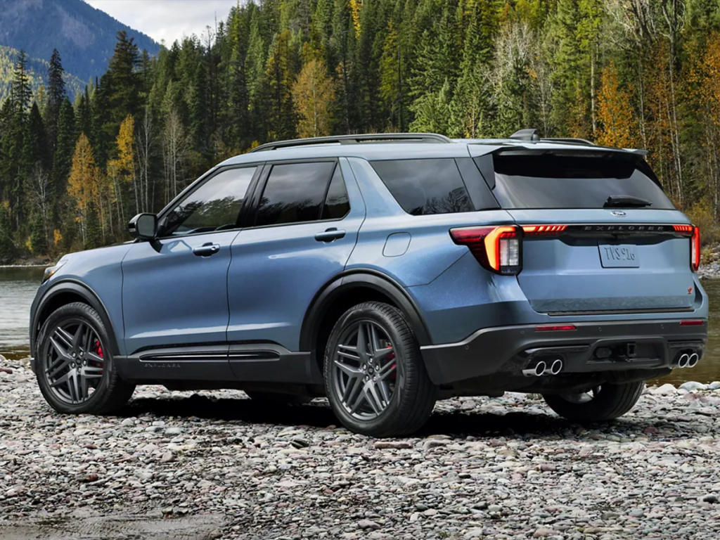 The 2025 Ford Explorer sits parked on a river bank. Shop for your new Ford Explorer at Cleveland Ford.
