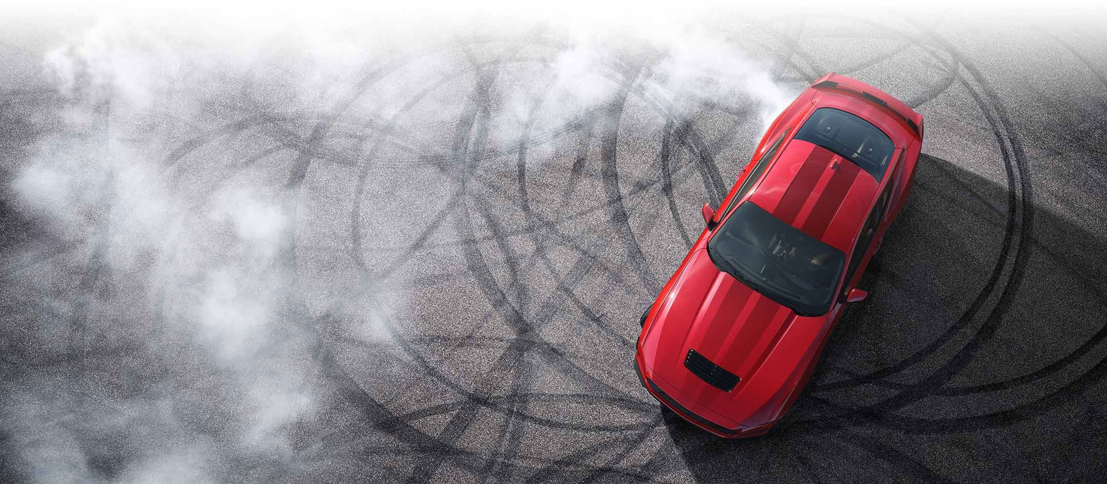 Overhead view of a 2024 Ford Mustang® model with tire tracks on pavement | Cleveland Ford in Cleveland TN