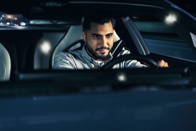 Person sitting in the driver’s seat of a parked 2024 Ford Mustang® coupe | Cleveland Ford in Cleveland TN