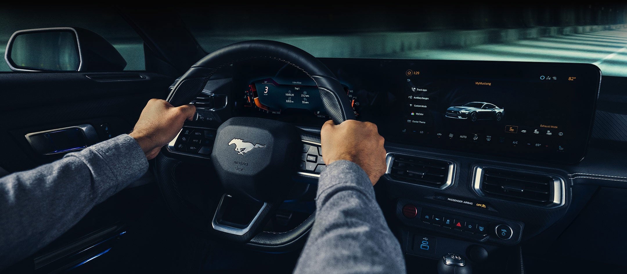 A 2024 Ford Mustang® model interior with a person driving | Cleveland Ford in Cleveland TN